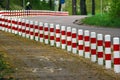 Striped red and white roadside safety posts Royalty Free Stock Photo