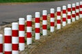 Striped red and white roadside safety posts Royalty Free Stock Photo