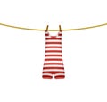 Striped retro swimsuit hanging on rope