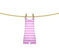 Striped retro swimsuit hanging on rope