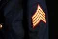 Striped Sergeant Sleeve Badge On Dark Background Royalty Free Stock Photo