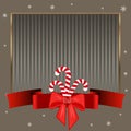 Christmas candy canes. Elegant strict silver background with gold frame for text on winter theme.