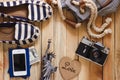 Striped slippers, camera, phone and miniature of the statue of liberty, top view