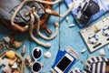 Striped slippers, phone and maritime decorations on the wooden background Royalty Free Stock Photo