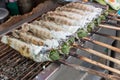 Striped snakehead fish grilled with salt. Pomegranate fish with salt and then burned for sales in the market. Thai style street f