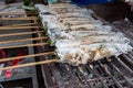 Striped snakehead fish grilled with salt. Pomegranate fish with salt and then burned for sales in the market. Thai style street f