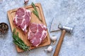 Striped steak on a wooden board with spices on a concrete plate. Ingredients for cooking