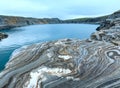 Striped stone near reservoir Storglomvatnet (Norge) Royalty Free Stock Photo