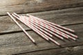 Striped straws for cocktails on a grey wooden background Royalty Free Stock Photo