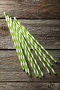 Striped straws for cocktails on a grey wooden background Royalty Free Stock Photo