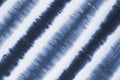 Striped tie dyed pattern on cotton fabric abstract background. Royalty Free Stock Photo