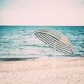 Striped Umbrella On Sandy Beach Royalty Free Stock Photo