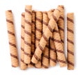 Striped wafer rolls with chocolate close-up on a white. Top view Royalty Free Stock Photo