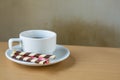 striped wafer rolls filled and coffee Royalty Free Stock Photo