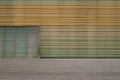 Striped wall and wooden floor and door