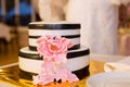 Striped wedding cake and pink flower Royalty Free Stock Photo