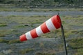 Striped windsock pouted from the wind at a local small airfield