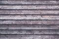 Striped wood surface. Grunge wooden fence. Shabby planks. Oak table with horizontal stripes. Dark board texture. Gray and brown lu Royalty Free Stock Photo