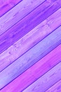 Striped wooden background diagonal abstract purple bright trendy neon color with boards surface texture, retro style concept