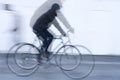 Movement of a cyclist with black jacket on white background Royalty Free Stock Photo