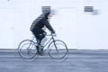 movement of a cyclist with black jacket on white background Royalty Free Stock Photo