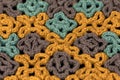 Stripes of multicolor crochet stitches as abstract flowers