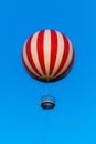 Stripped air ballon fly in blue sky Royalty Free Stock Photo