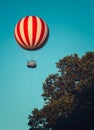 Stripped air ballon fly in blue sky Royalty Free Stock Photo
