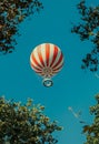 Stripped air ballon fly in blue sky Royalty Free Stock Photo