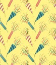 Stripped and dotted confetti petards seamless pattern on yellow background