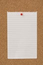 Stripped note paper swith push pins on cork board. Empty paper pages for notes copy space Royalty Free Stock Photo