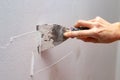 Stripping old paint from the wall. Renovation and painting of walls in the apartment Royalty Free Stock Photo