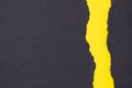 Strips of black torn paper on yellow cardboard, for your message, grunge background Royalty Free Stock Photo