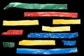 Strips of colored tape on a black background for lower third Royalty Free Stock Photo