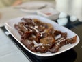 Fried sun-dried beef on a white plate Royalty Free Stock Photo