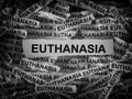 Strips of newspaper with the words Euthanasia typed on them. Royalty Free Stock Photo