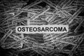 Strips of newspaper with the words Osteosarcoma typed on them Royalty Free Stock Photo