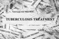 Strips of newspaper with the words Tuberculosis treatment printed on them Royalty Free Stock Photo