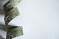 Strips of old punched tape on a white surface Royalty Free Stock Photo