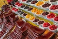 Strips of Processed Sour Fruits and Bowls of Traditionally Dried Plums and Cherries in Iran Royalty Free Stock Photo