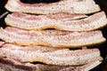 Strips of raw bacon ready to fry Royalty Free Stock Photo