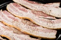 Strips of raw bacon ready to fry Royalty Free Stock Photo