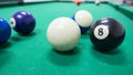 Strips and solds balls on green pool table