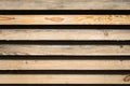 Strips of wooden boards on a black background. Wood lumber. Stock of timber wood construction in warehouse. Royalty Free Stock Photo