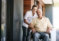 Striving to provide quality care for all her patients. Portrait of a nurse caring for a senior patient in a wheelchair Royalty Free Stock Photo