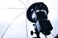 Strobism, on camera system flash on a rack with an umbrella in the studio Royalty Free Stock Photo