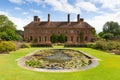 Strode House Barrington Court near Ilminster Somerset England uk with Lily pond garden in summer