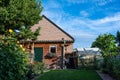 Stroe, Gelderland, The Netherlands, Garden shed, green lawn and blue sky of a residential house