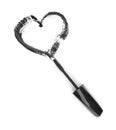 Stroke of black mascara in the form of heart with applicator brush Royalty Free Stock Photo