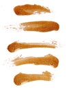 Strokes of golden nail polish